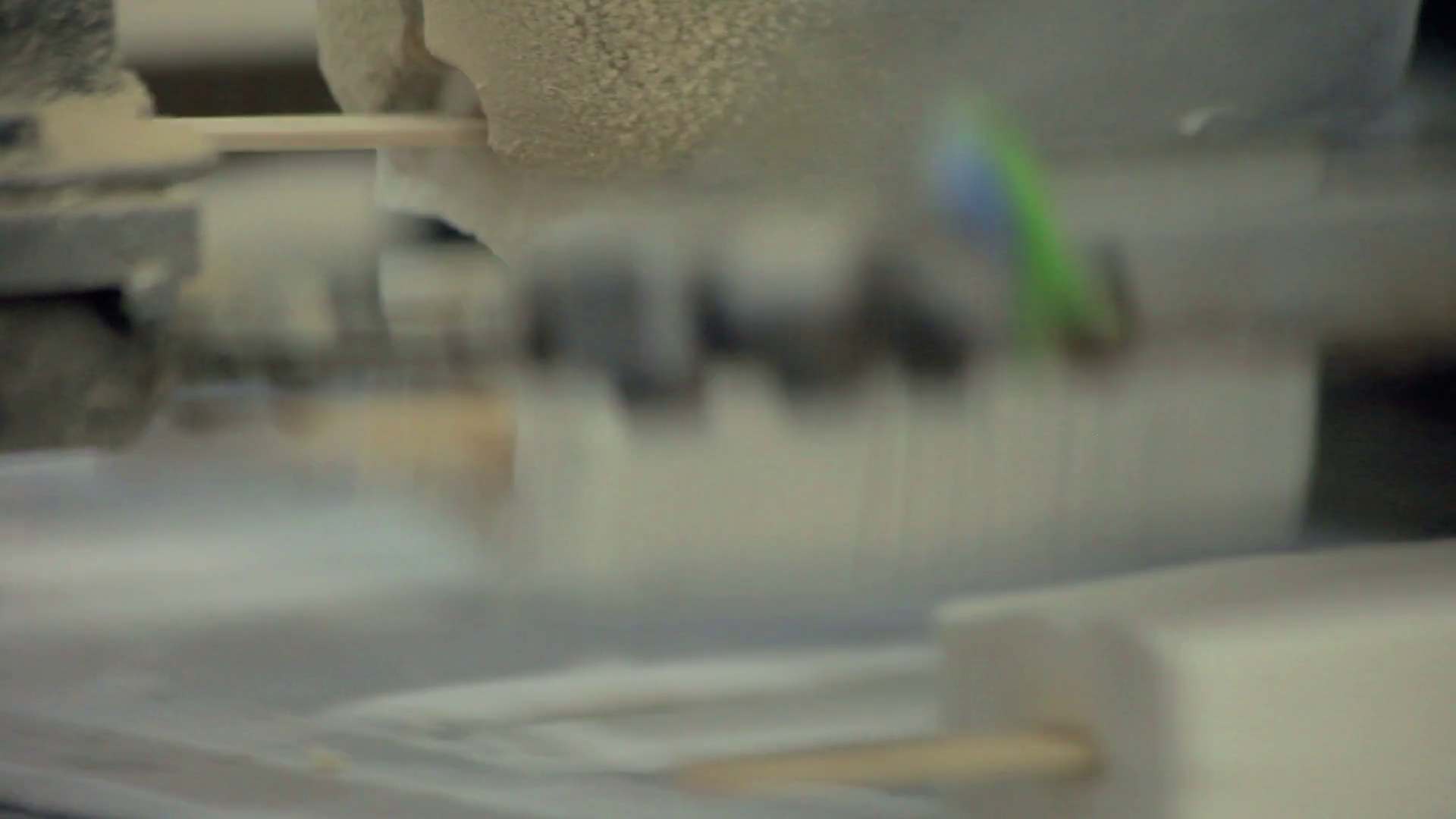 Manufacturing process at food factory. Ice cream machine. White ice