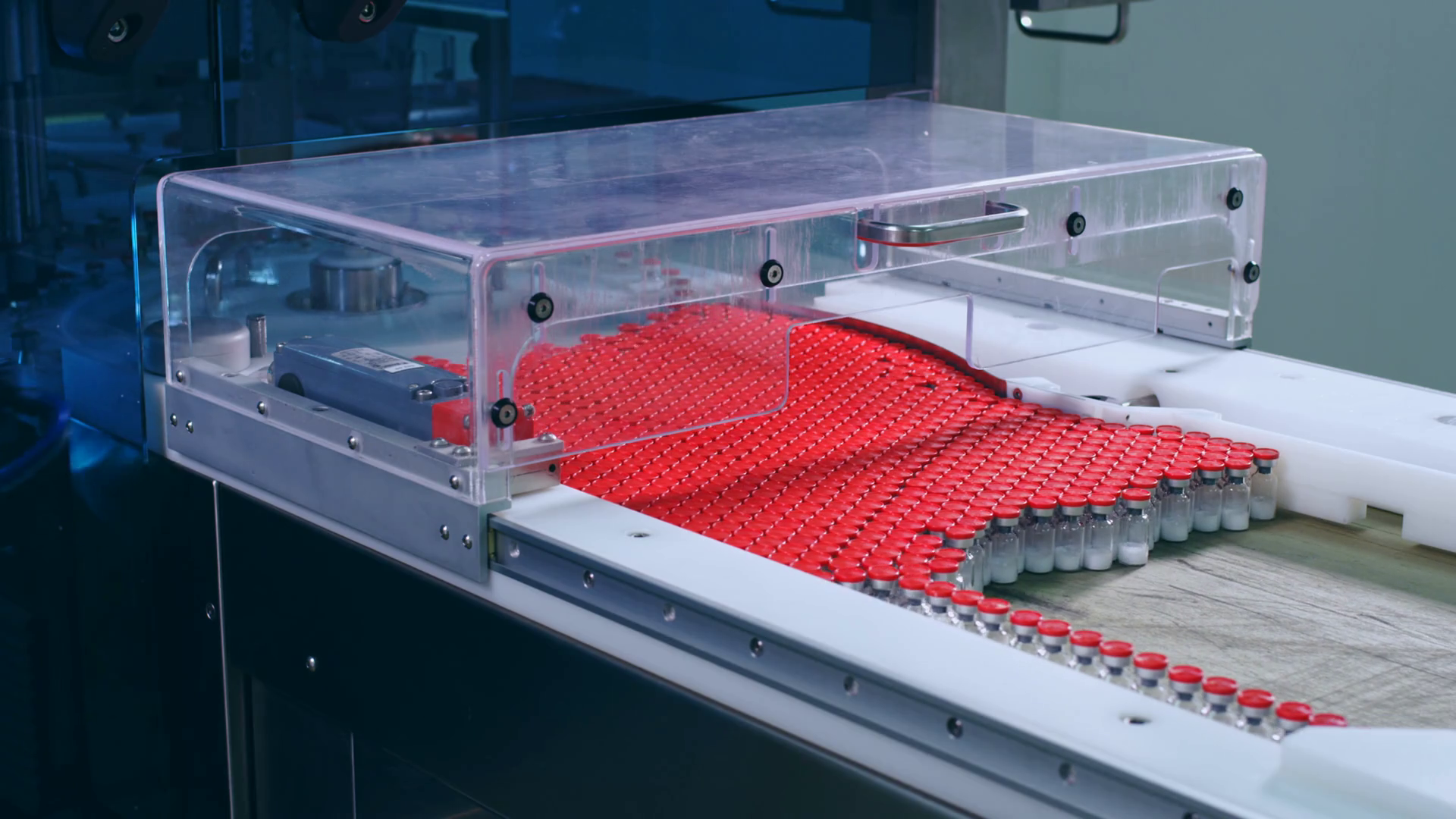 Medical bottles on pharmaceutical manufacturing line at medical factory. Medicine bottles at