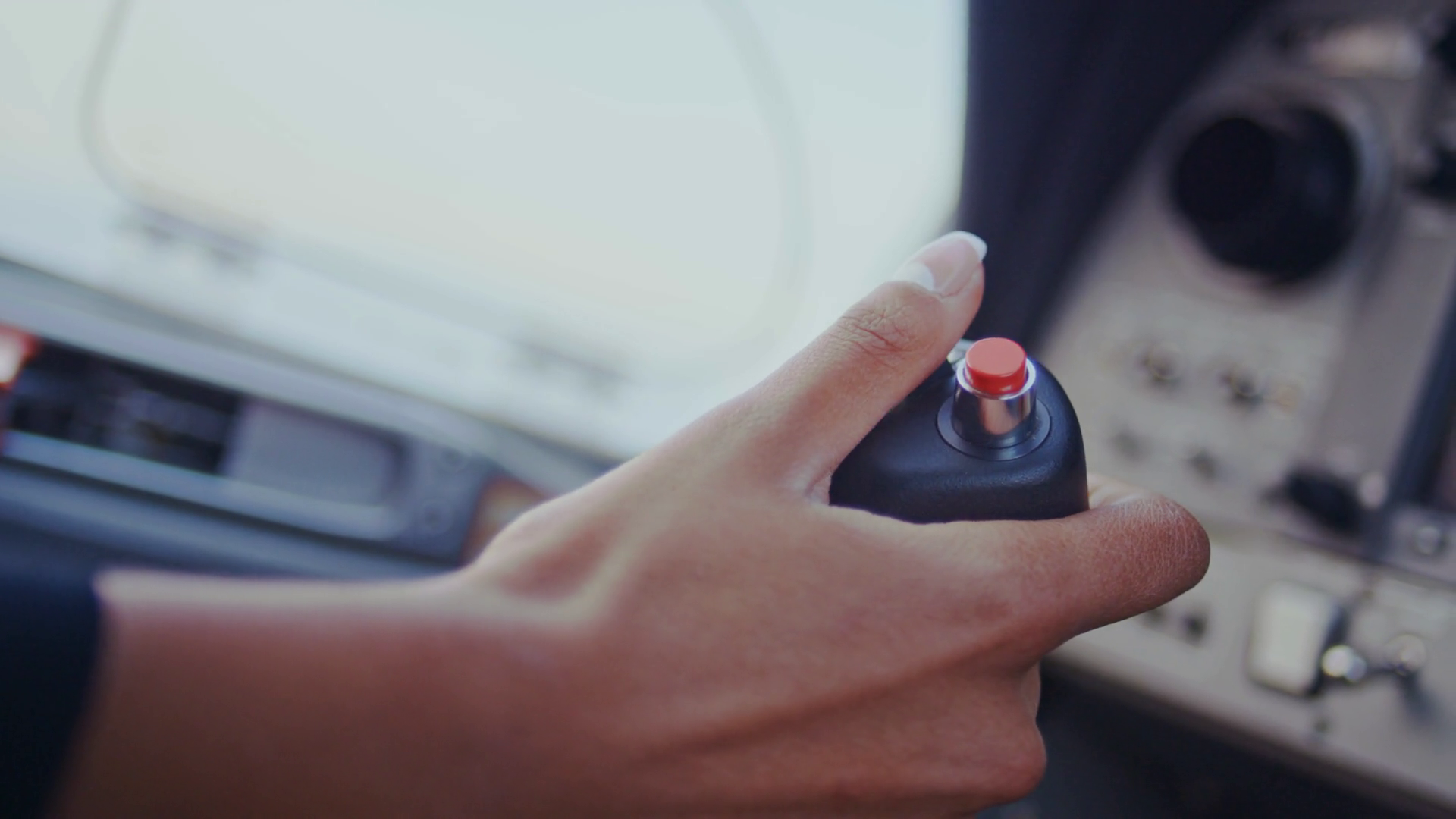 Plane joystick. Plane control panel. Woman hand control lever of