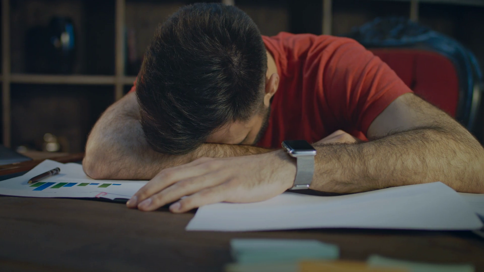 Tired business man lying on papers at table. Close up of businessman