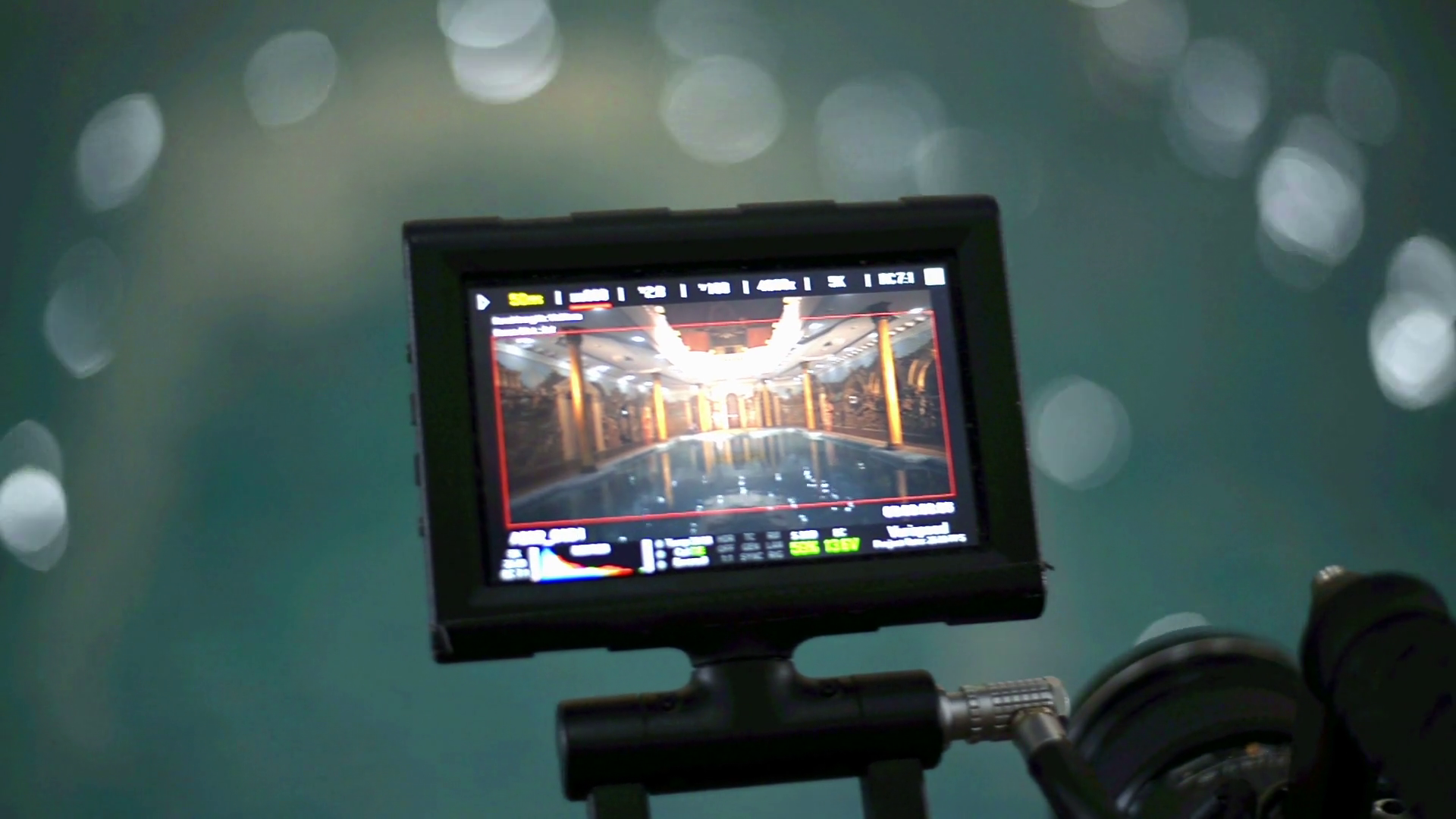 Video camera external monitor. Professional camera recording a swimming