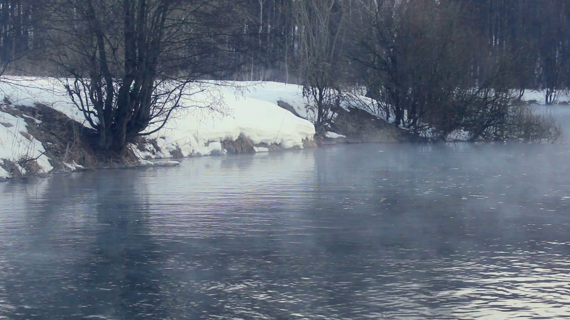 Winter scene. Fog over winter river. Forest river in winter. Misty