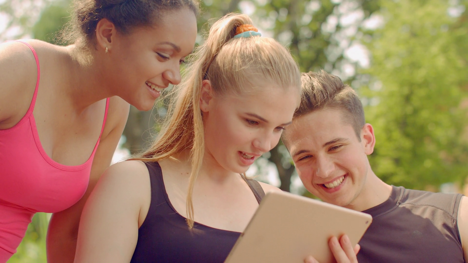 Young people having fun. Friends tablet computer. Closeup of happy ...