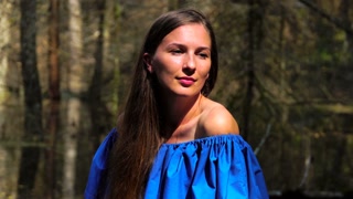 Close-up of a girl with long hair. in the nature