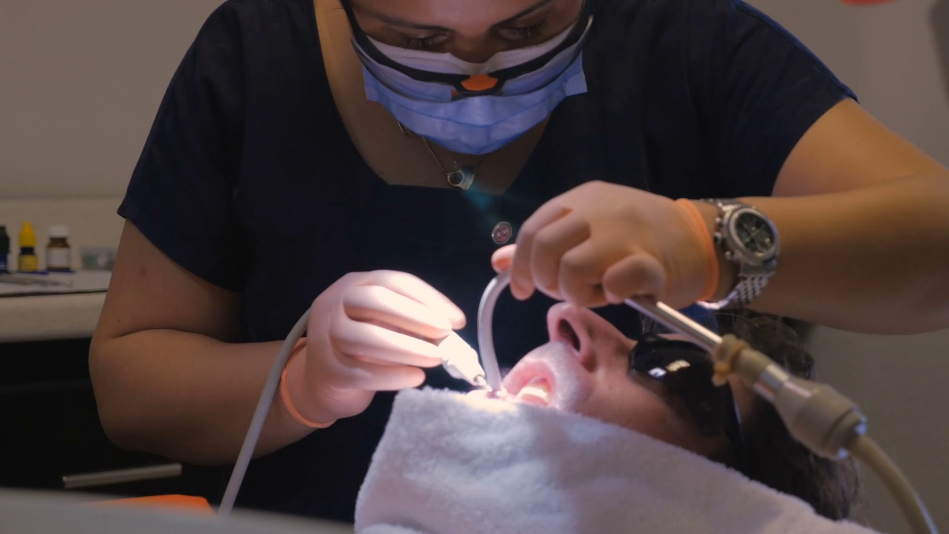 A Dentist Using Ultrasonic Scaler To Clean Stock Footage SBV307162409