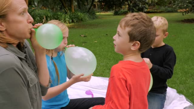 Mom Blowing Balloon Stock Footage: Royalty-Free Video Clips - Storyblocks