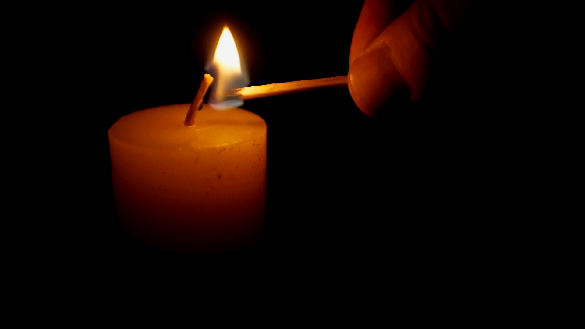 Lighting Candle With Black Background Stock Footage SBV338434996