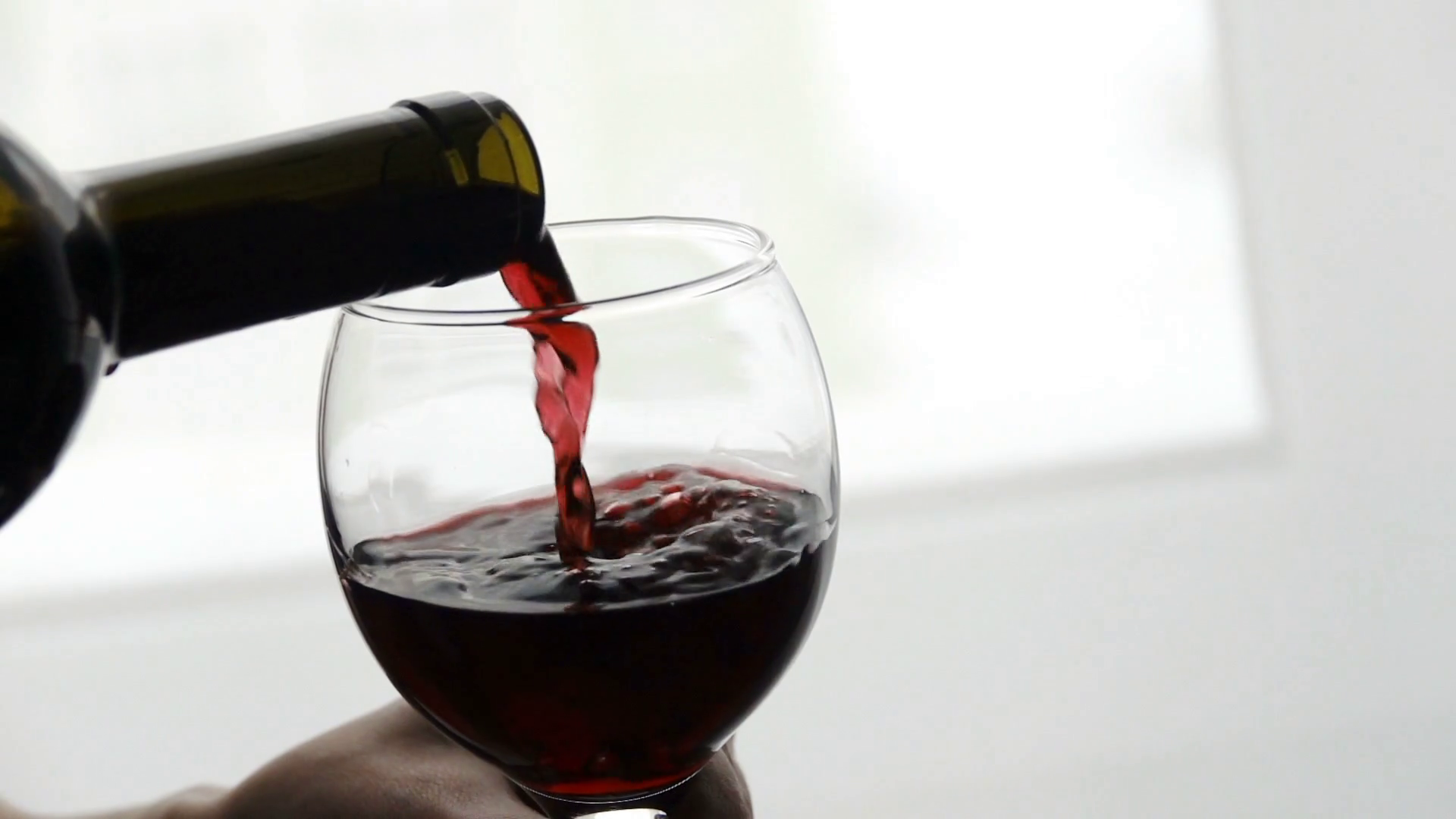 Filling Wine Glass With Red Wine Slow Motion Stock Footage SBV