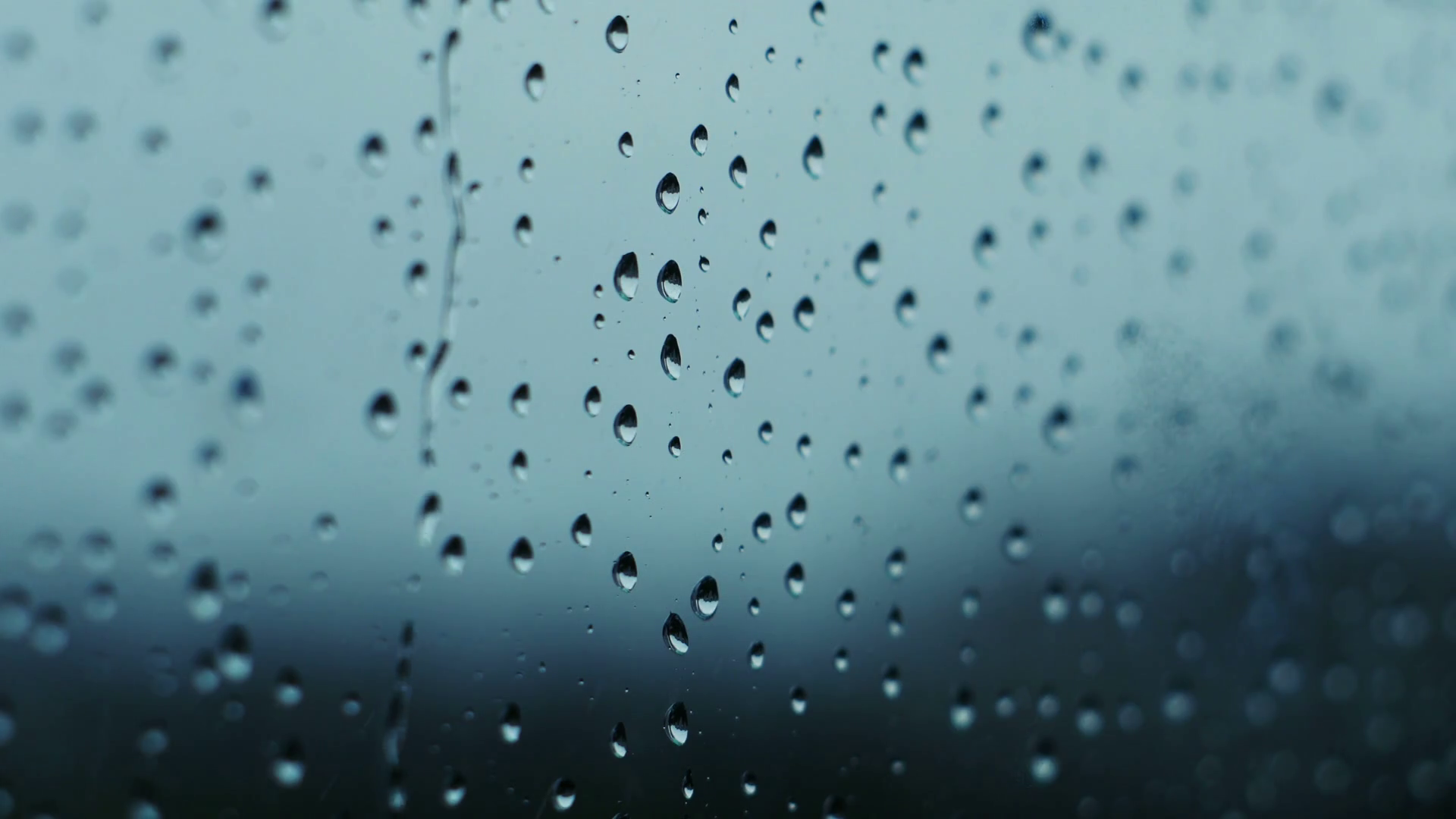 Raindrops running down a window pane Stock Video Footage 0012 SBV