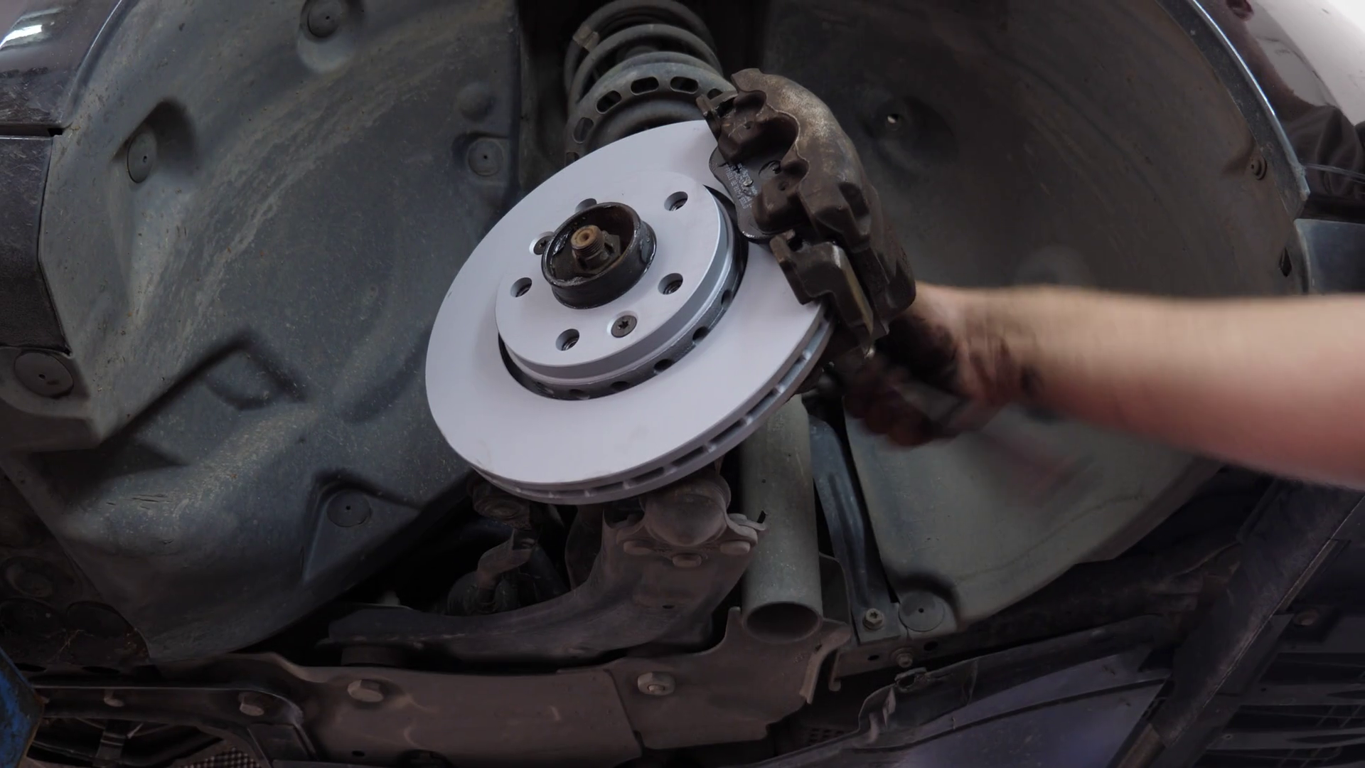 A Car Mechanic Changing Disc Brakes Backing Stock Footage SBV338354046