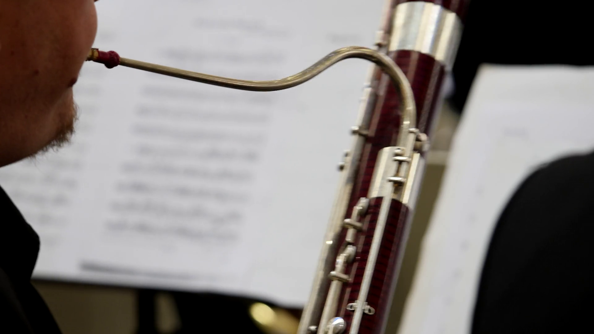 Footage of a musician playing on his bassoon... Stock Video Footage 00