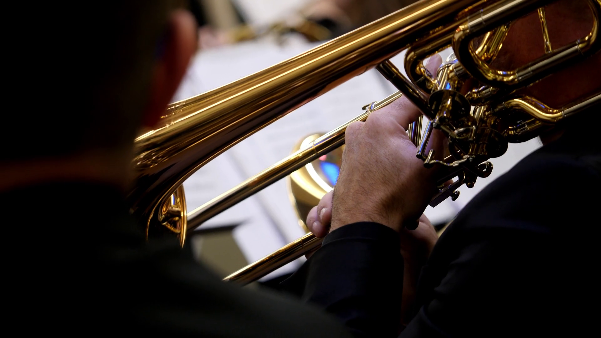 Footage of a person playing on a trombone... Stock Video Footage