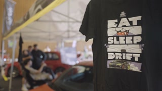 SLOVENIA, LJUBLJANA - 10. MAY 2025: Drift cars fan t-shirt merch Eat-Sleep-Drift at Auto Motor Show Ljubljana 4K