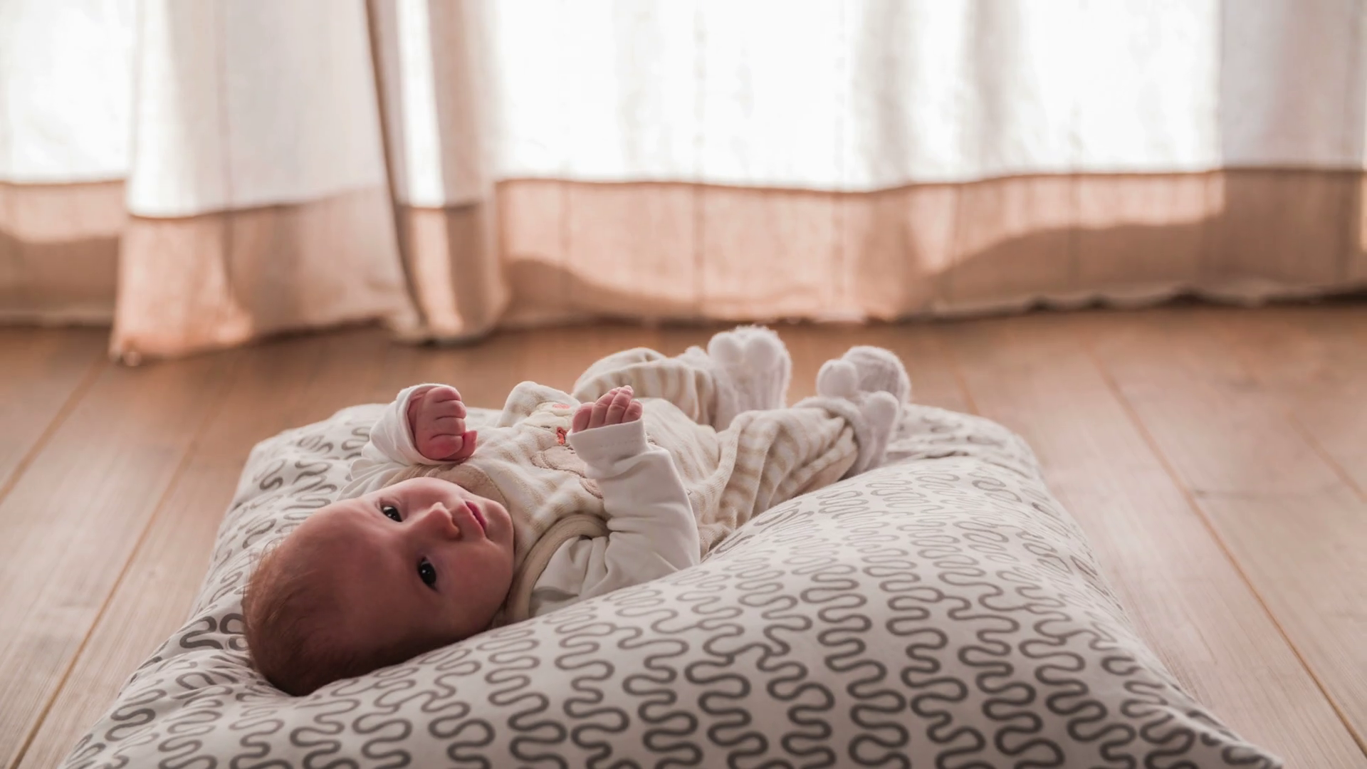 Baby lay on a pillow jib shot 4K Stock Video Footage Storyblocks