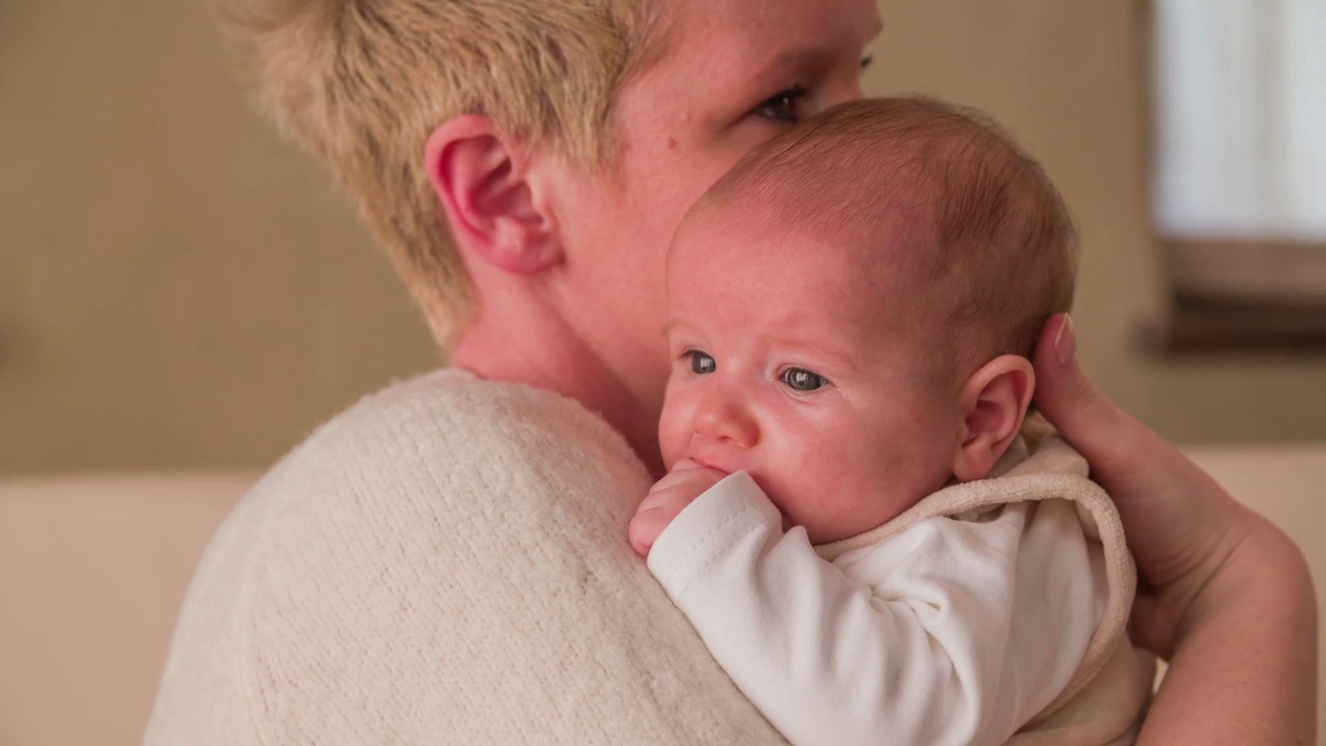 Mother Caressing Baby On Shoulder Close Up 4k Stock Footage SBV
