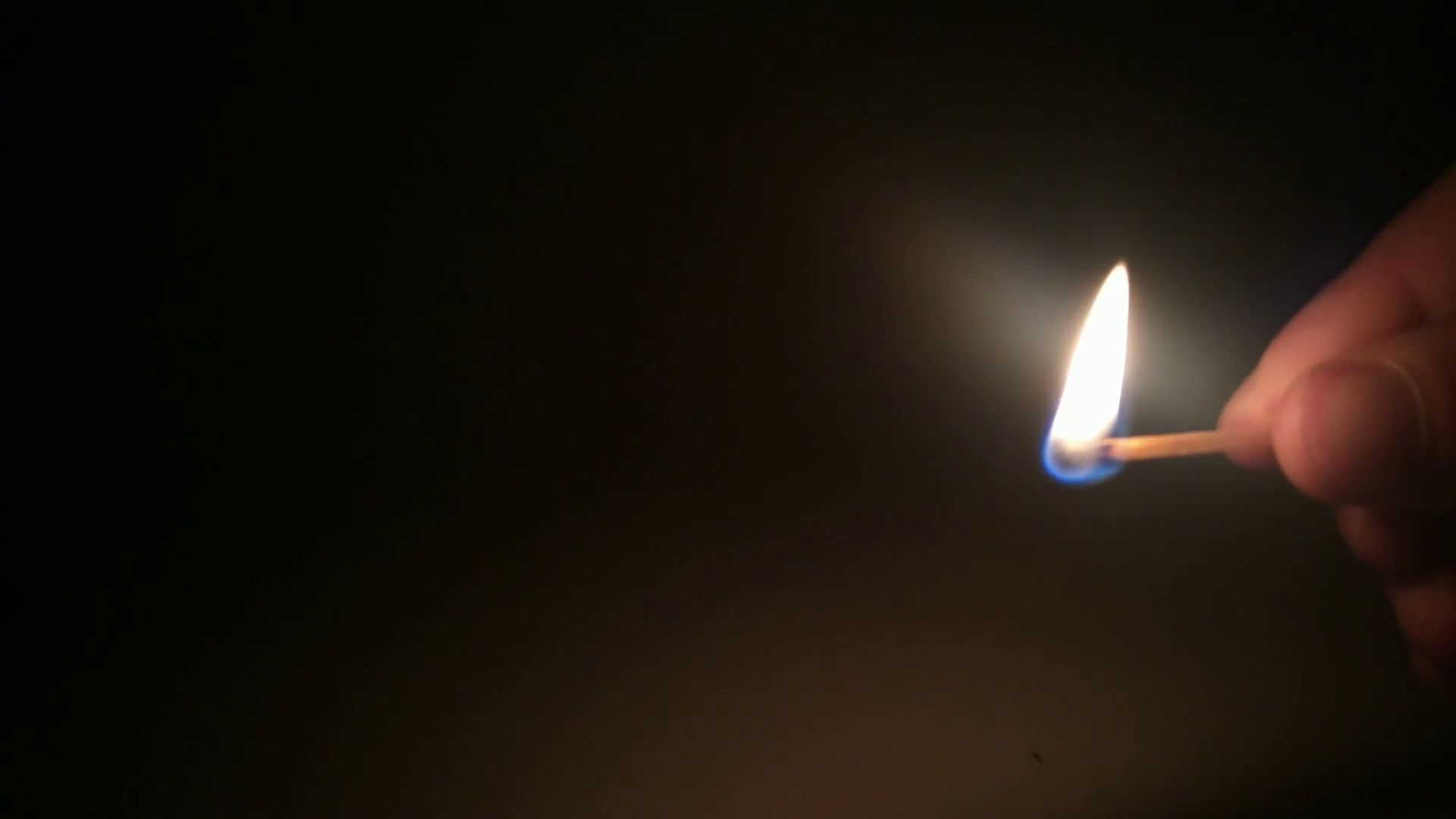 Man lights a match in the dark. Burning match close up. Stock Video