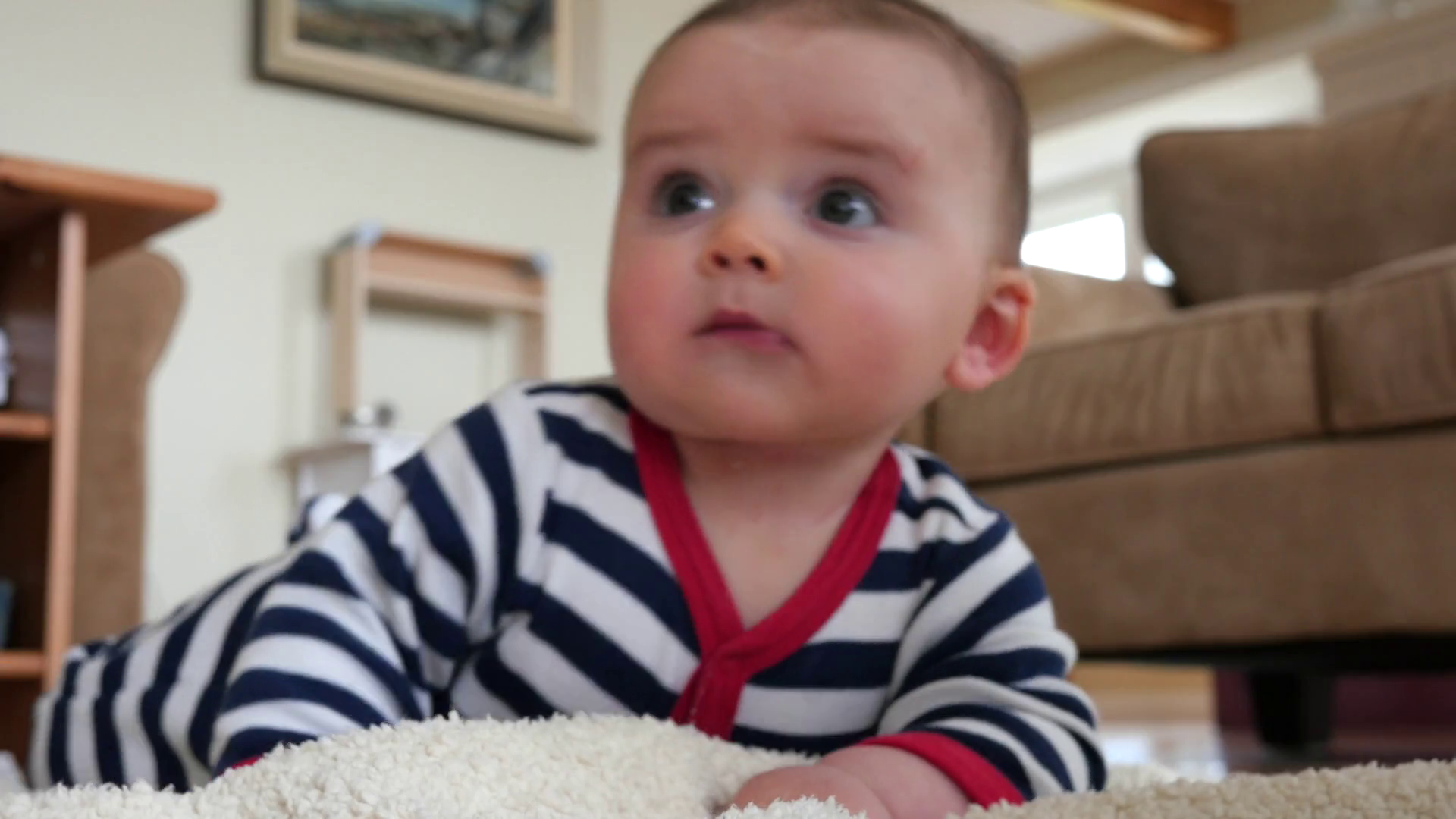 Baby rolls over for the first time Stock Video Footage 0016 SBV