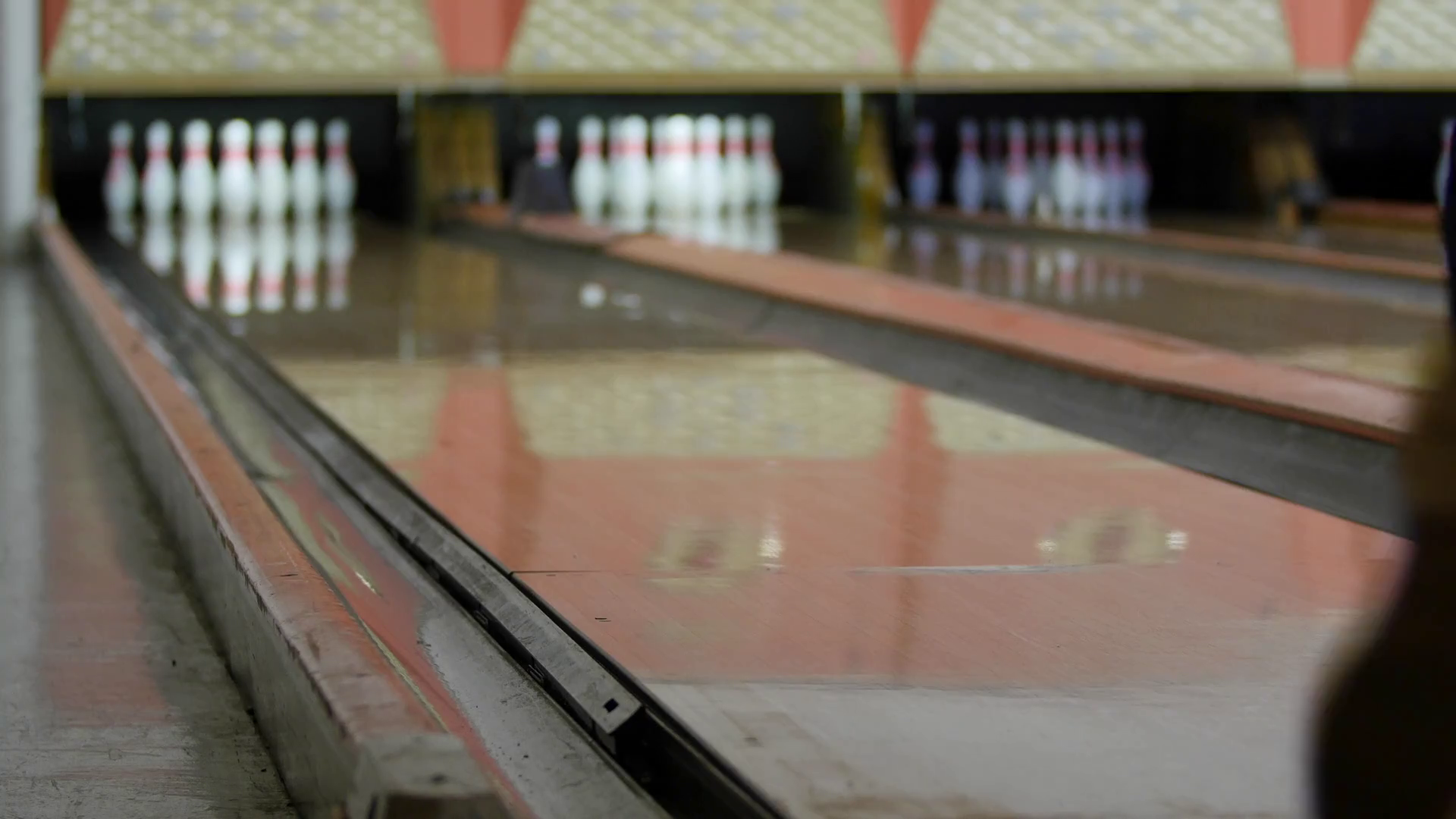 Man hits pins with bowling ball in bowling alley Stock Video Footage 00