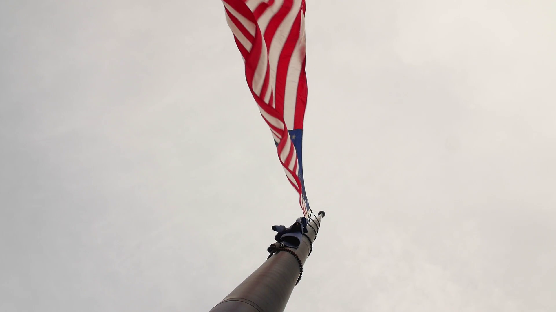 Slow Motion the United States Flag at half mast blowing in wind Stock