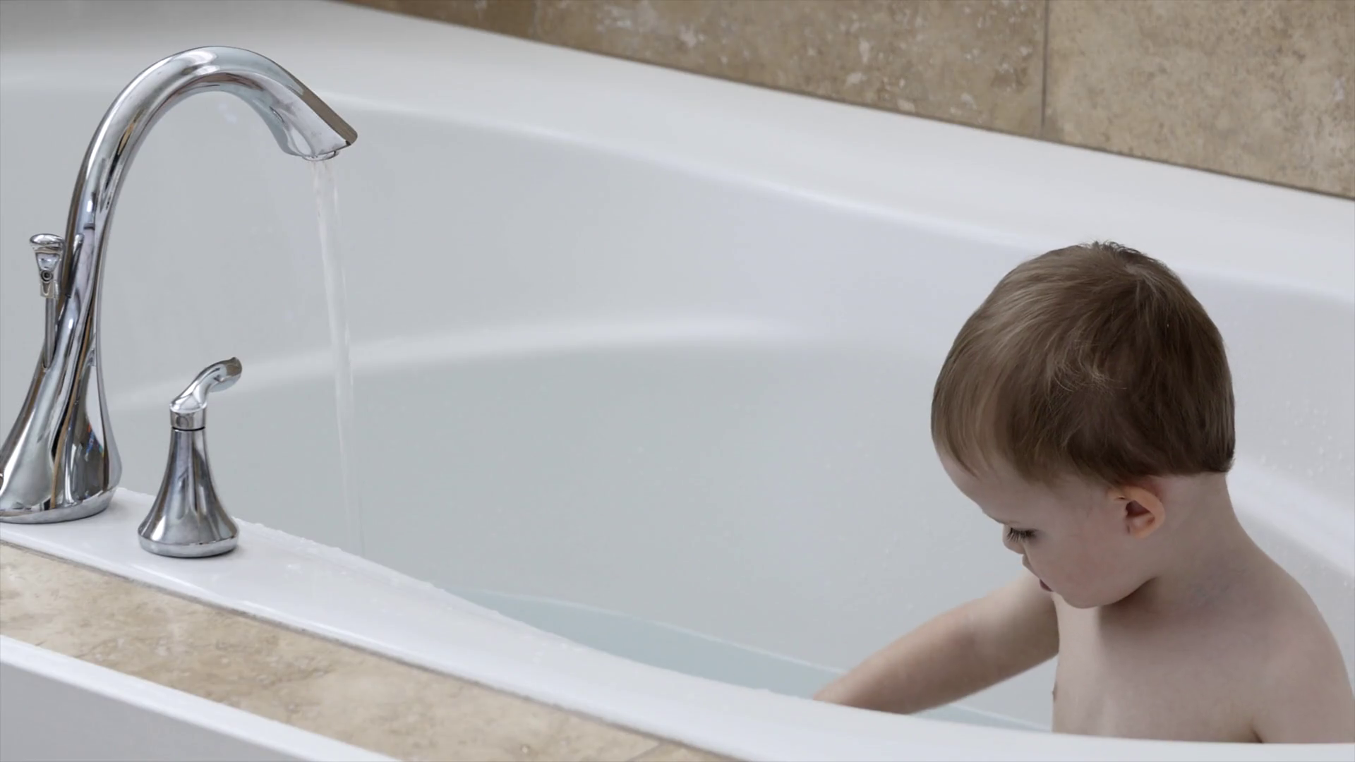 Toddler Taking Bath In Large Bath Tub Stock Footage SBV301042307