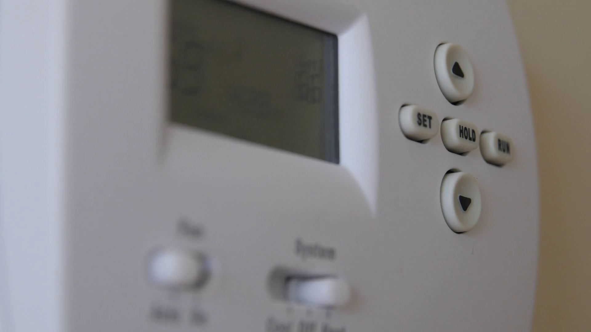 Turning up the temperature on a thermostat Stock Video Footage
