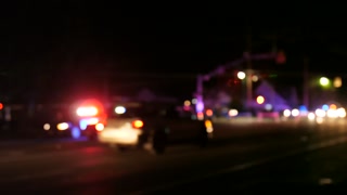 Emergency Police Vehicle Lights Flashing At Night At Crime Scene