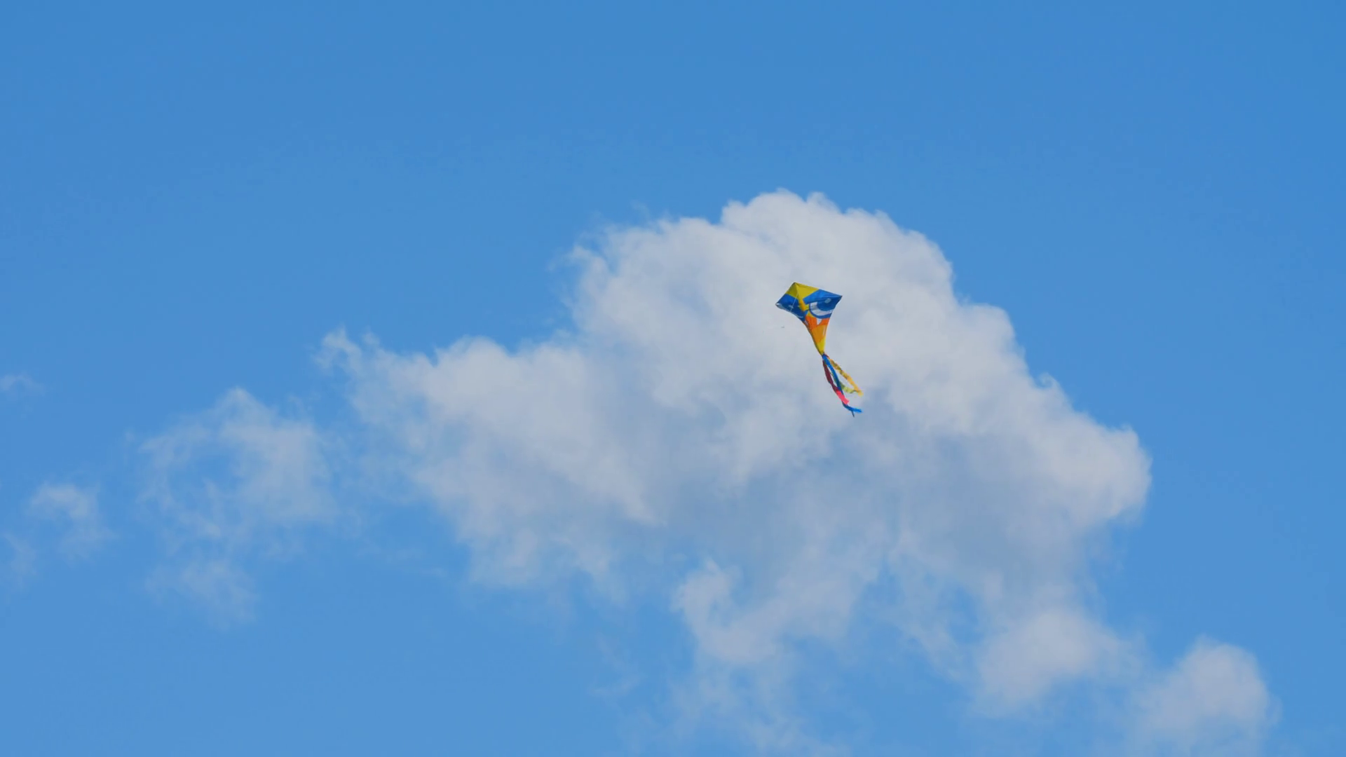 Colourful Kite Flying On Over Blue Sky Stock Footage SBV338662028