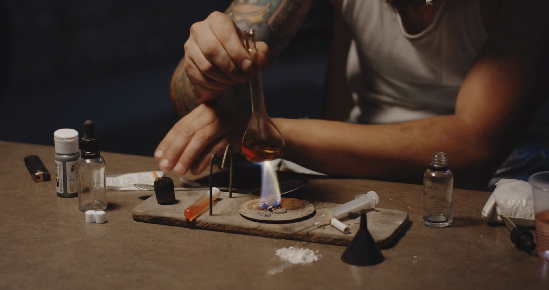 Closeup of a drug addict heating drug in a spoon over flame Stock