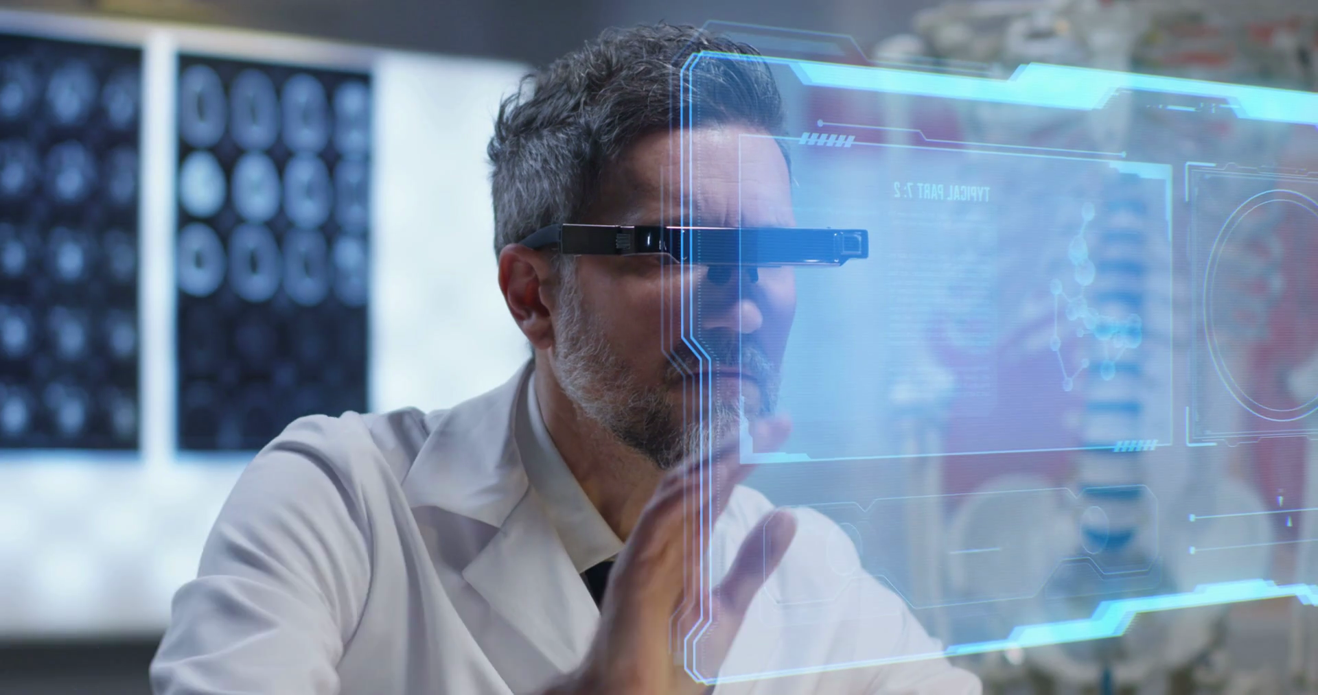 Medium closeup of a VR headset wearing doctor using an interactive