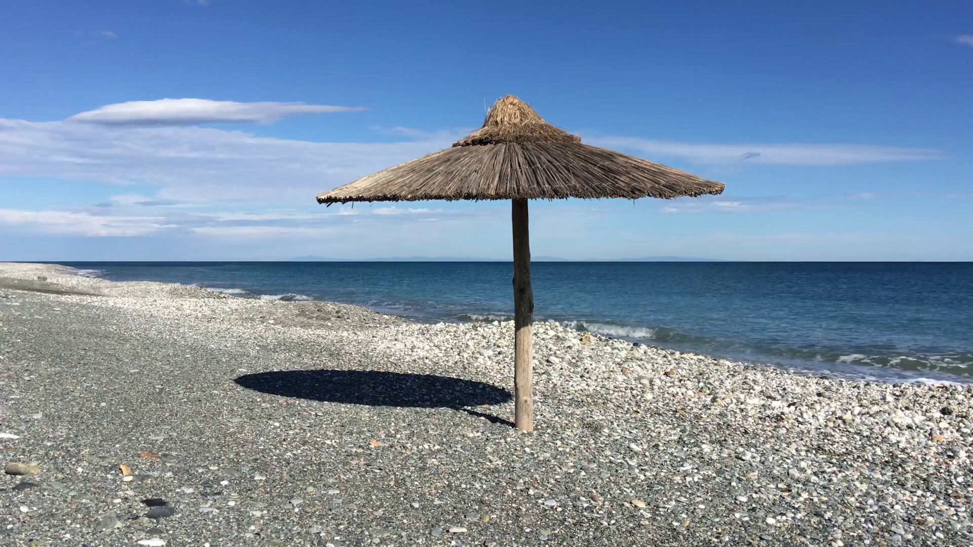 Parasol at velika beach in Greece Stock Video Footage 0024 SBV