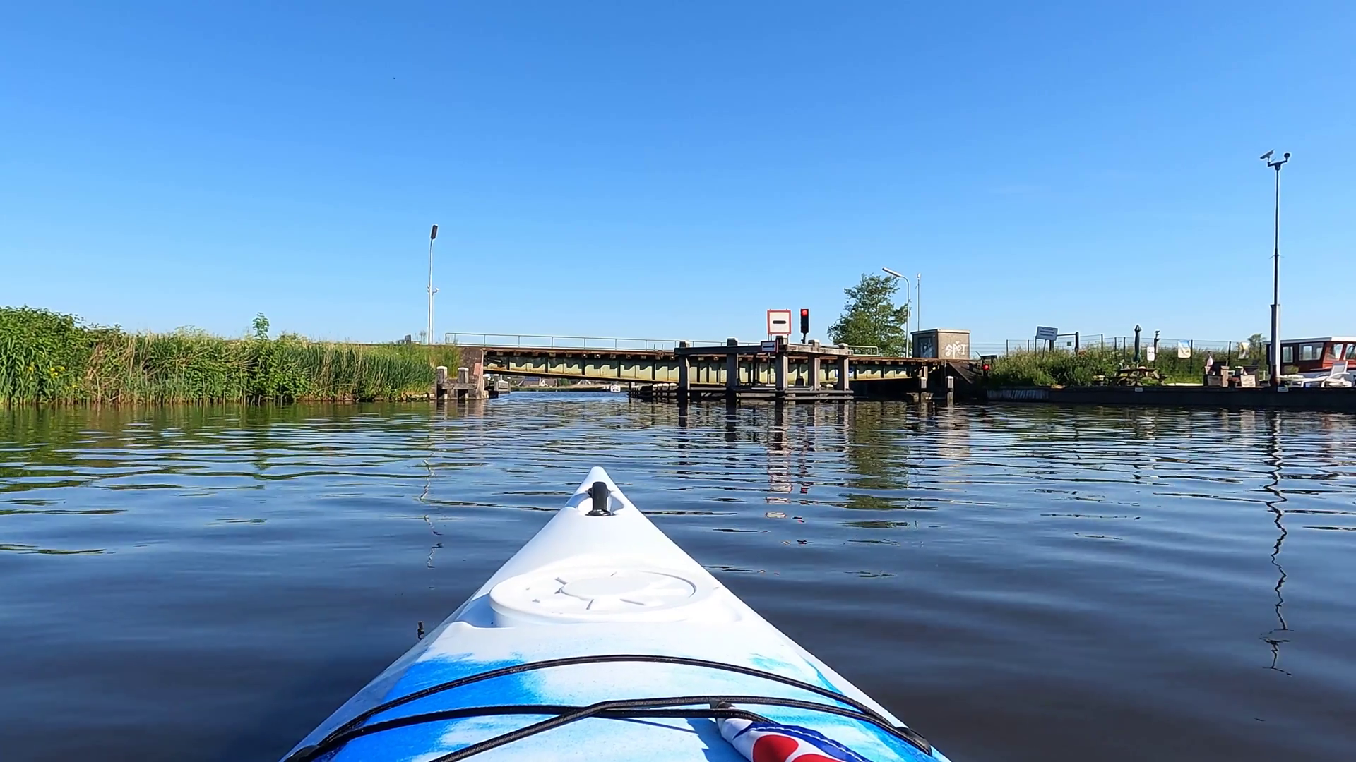 Canoeing Towards Passing By Railway Bridge Stock Footage SBV346557675
