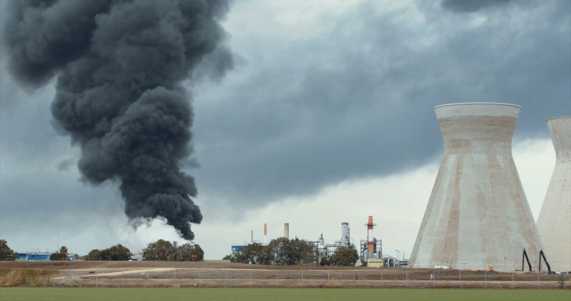 Accident in an oil refinery explosions and fire with black smoke