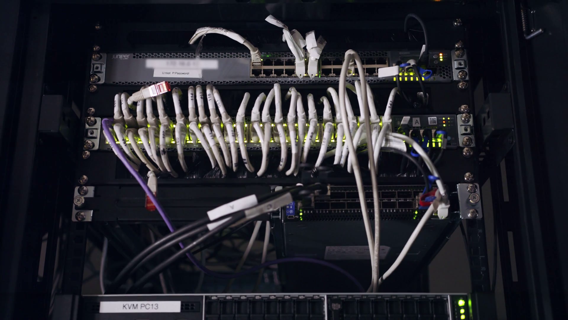 Close up shot of data servers with cables and blinking hard