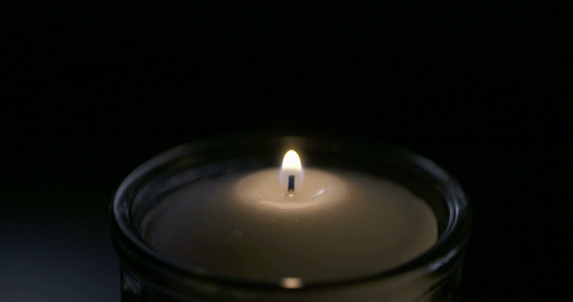 Candle blown out with smoke rising from wick Stock Video Footage