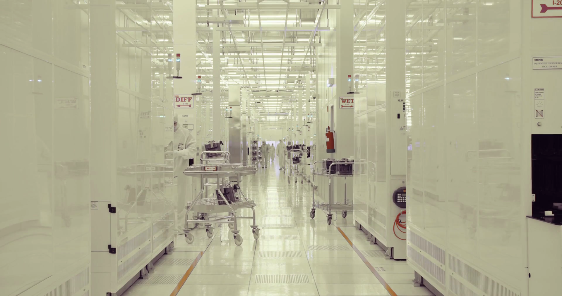 Workers in clean room in a semiconductors manufacturing facility Stock