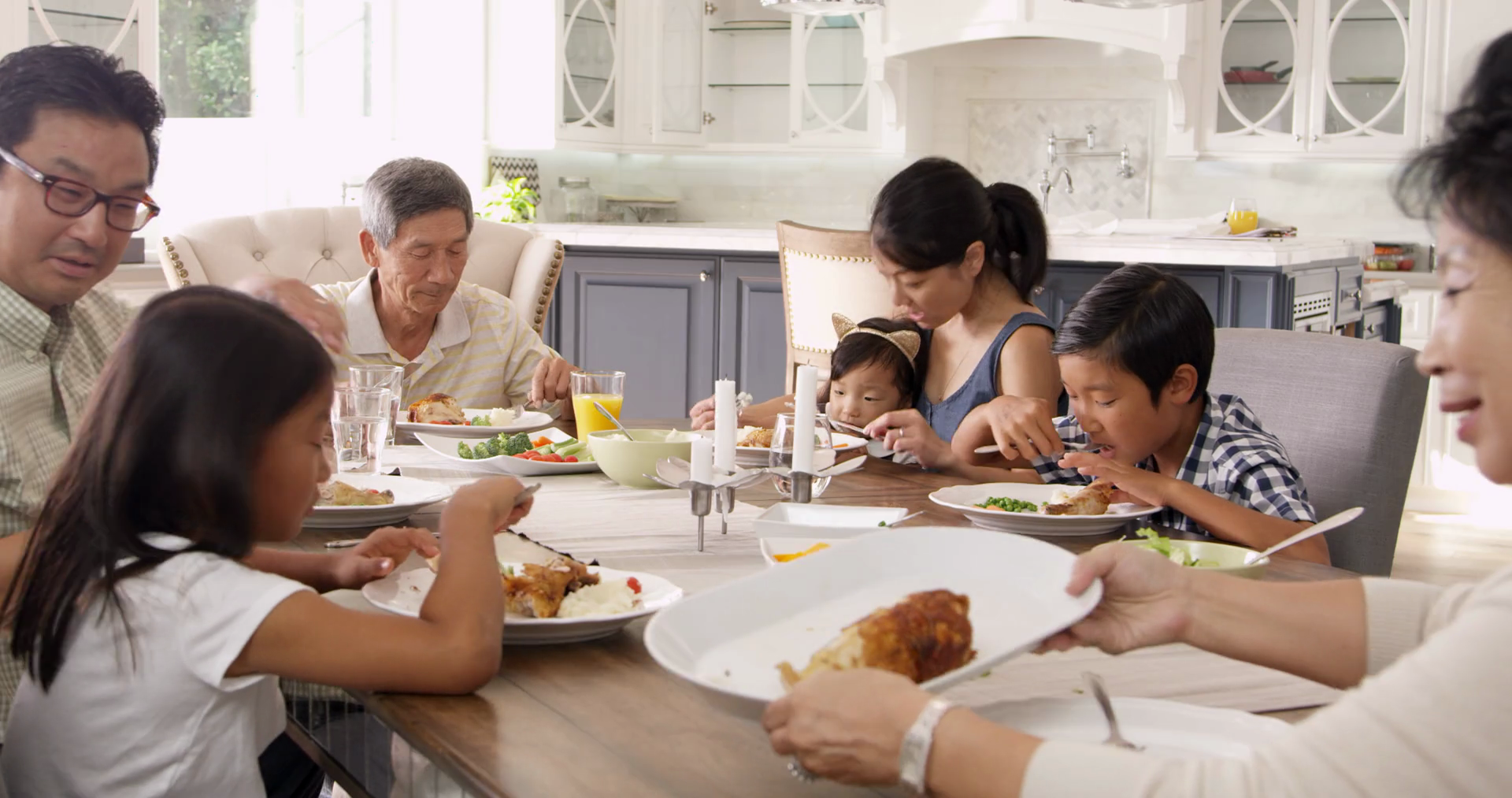 Extended Family Group Eating Meal At Home Shot On R3D Stock Video