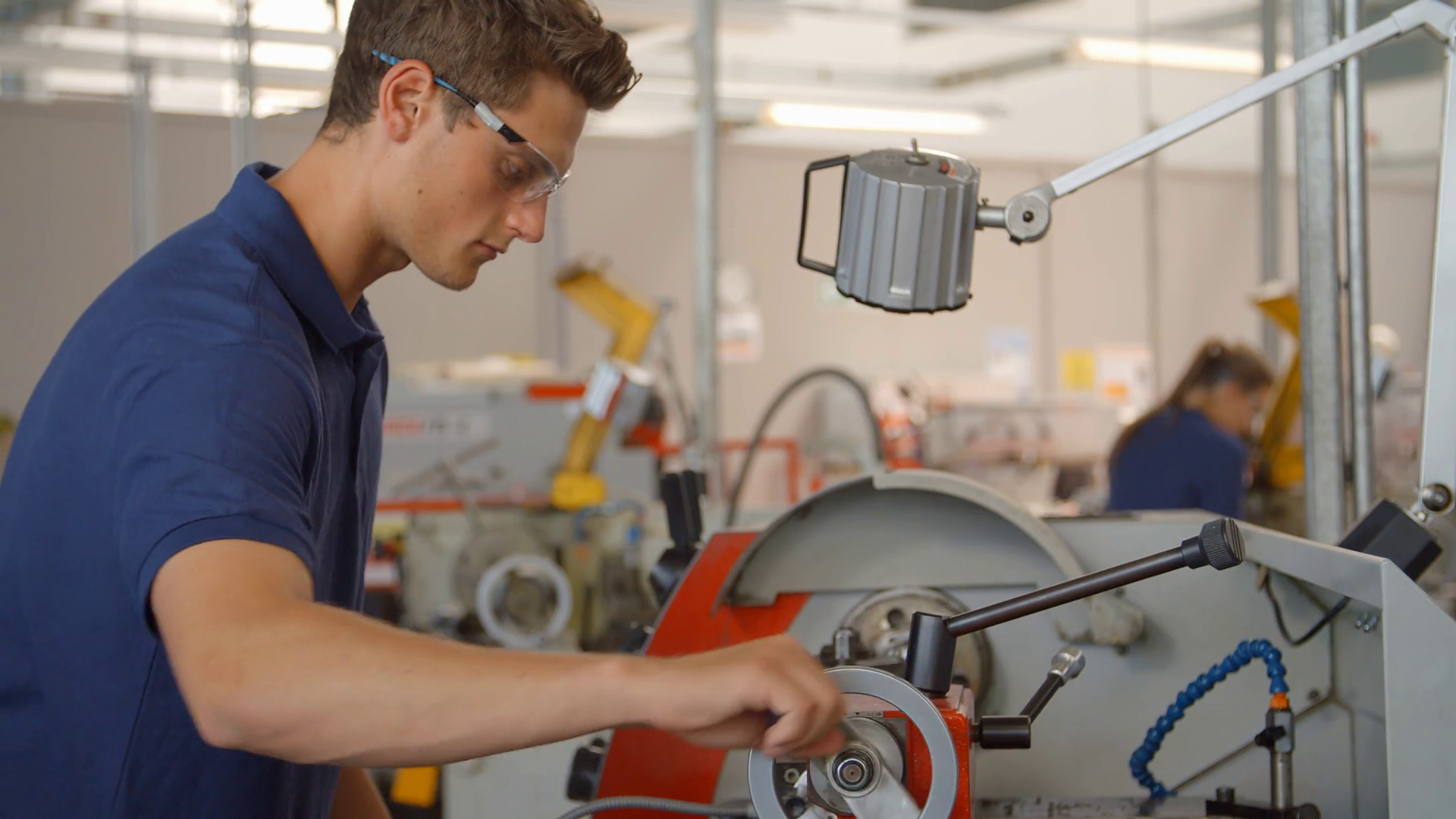 Apprentice Engineer Using Machinery In Manufacturing Plant Stock Video