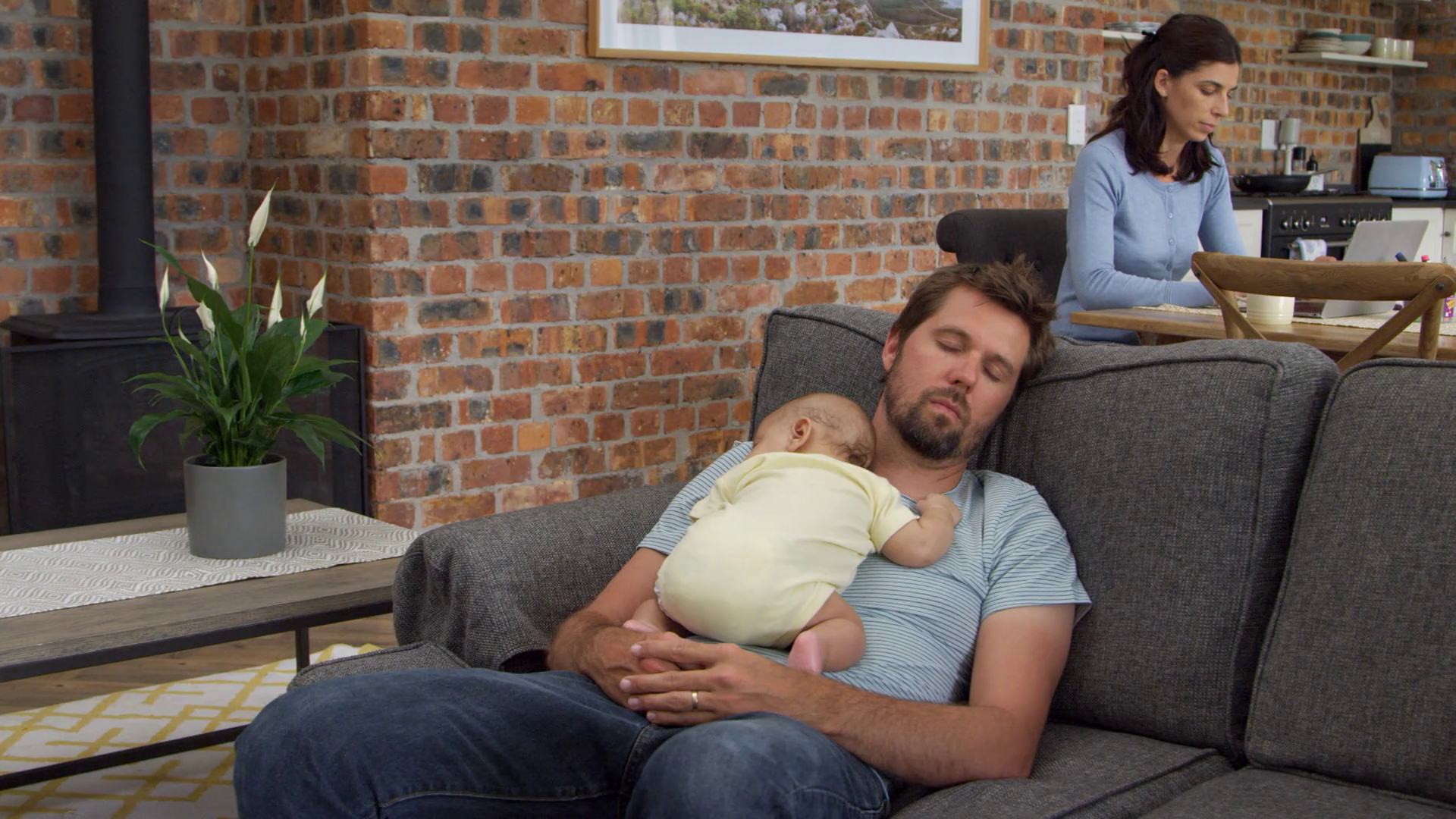 Father With Baby Son Sleep On Sofa Mother Stock Footage SBV316593345