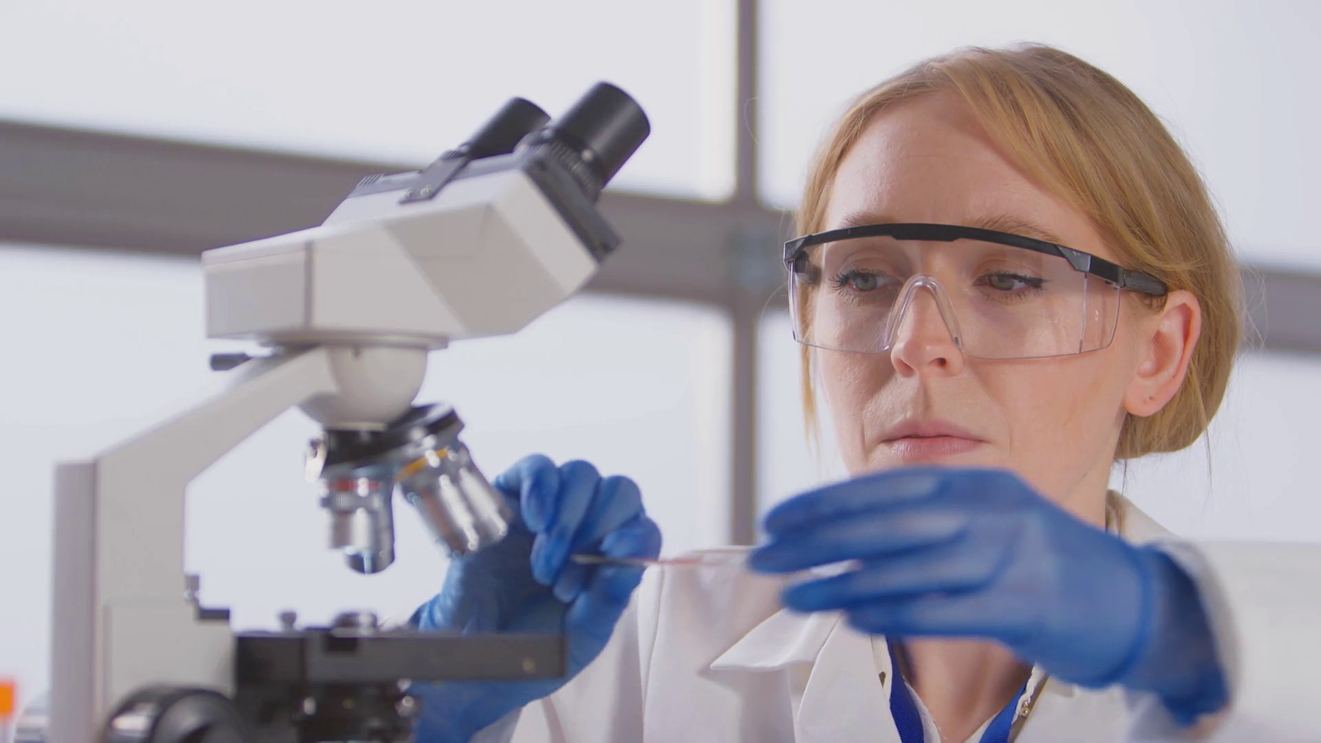 Female Lab Worker Putting Slide Under Stock Footage SBV-346766797 ...