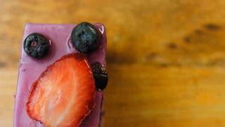 French Mousse Cake with blueberries and strawberries. Macro and slider shooting