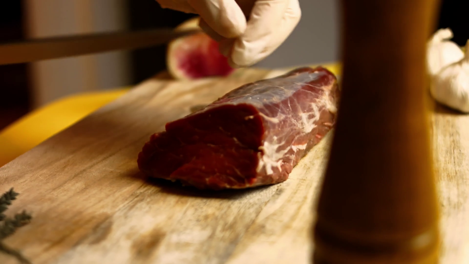 Chef trimming raw beef tenderloin on wooden board Stock Video Footage