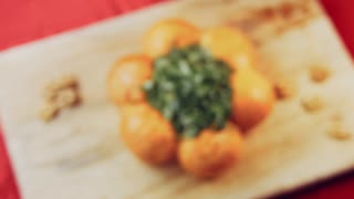 Bread with greens and garlic  served on wooden board, lens distortion effect
