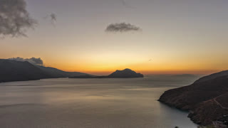 Panorama showing Amorgos island aerial day to night timelapse from above. Greece