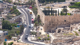 panoramic view on Jerusalem timelapse with traffic on the road from the Mount of Olives.