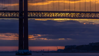 Lisbon city sunrise with April 25 bridge night to day timelapse
