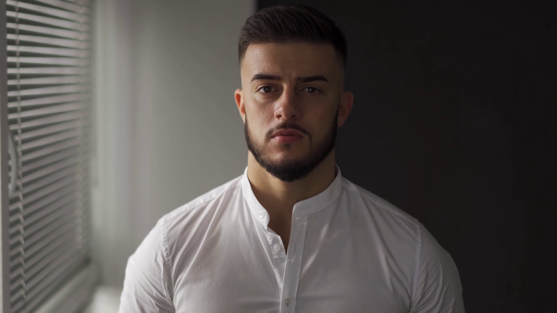 young man with a beard look at camera. Business man in