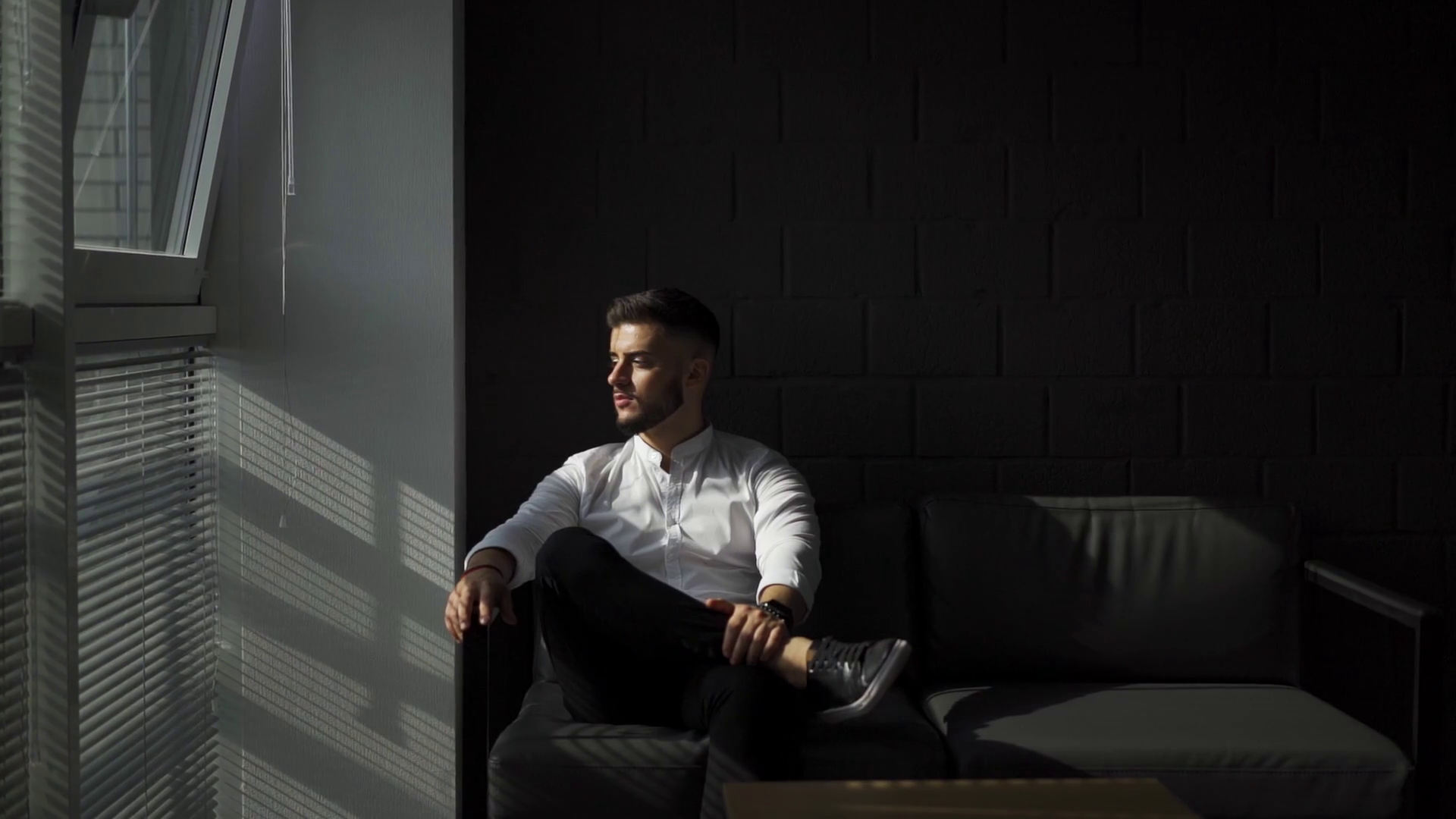 Young Man With A Beard Turning His Head And Look At Camera Business Man In Office Slow Motion 