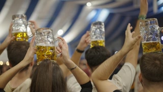 Group of Adults with Beer Mugs on Their Heads in Spain