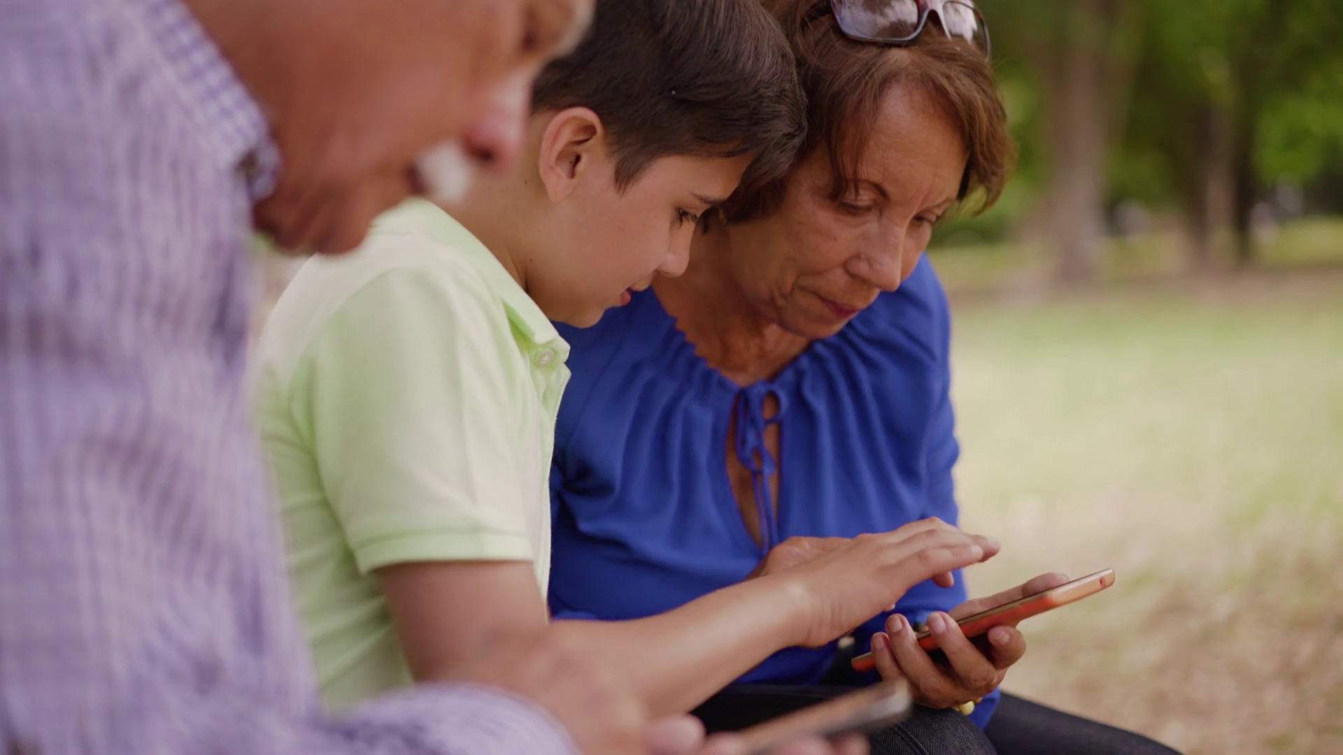 14Child Helping Grandma Text Messaging On Mobile Phone Stock Video