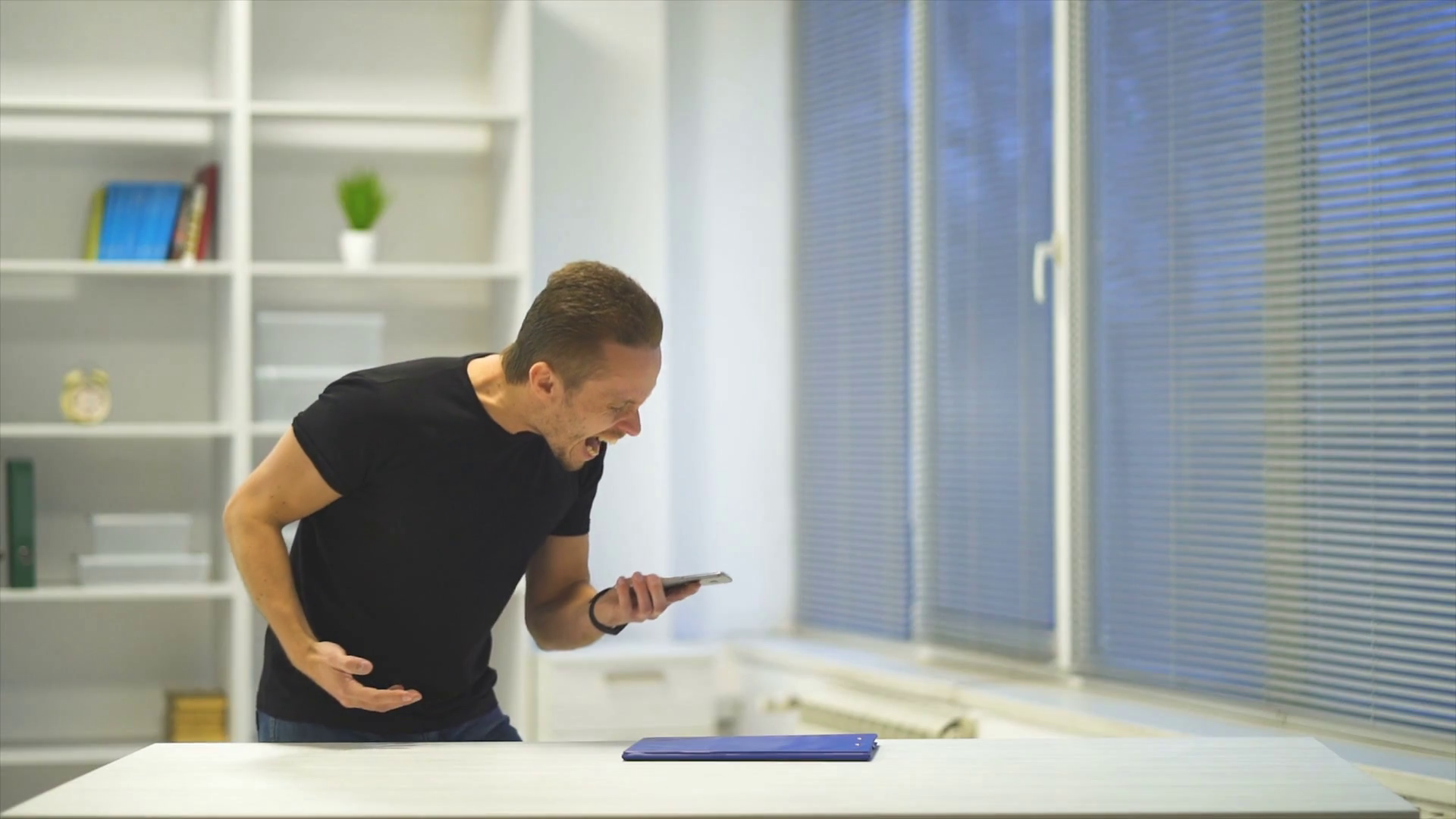 The Emotional Man Throwing Phone On Table Stock Footage SBV329651578